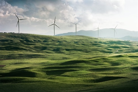 energy windmills on green hillside